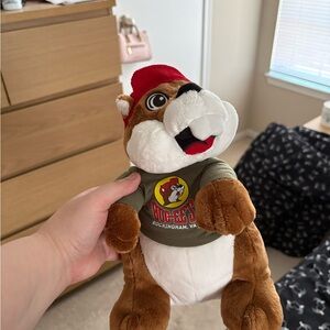 Bucees Brown and White Plush Toy with Red Hat
